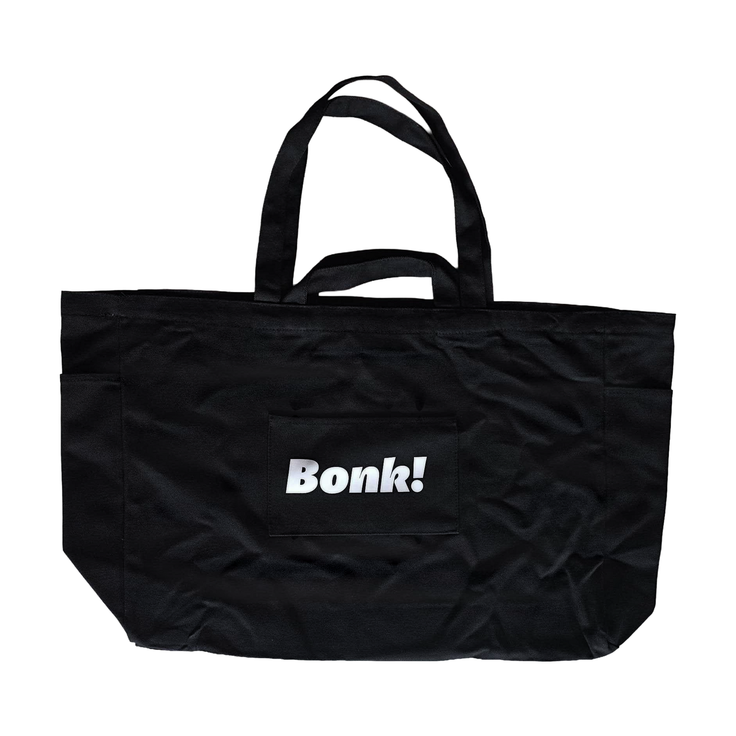 Bonk Canvas Tote in black, back, showing the front pocket and small Bonk! logo