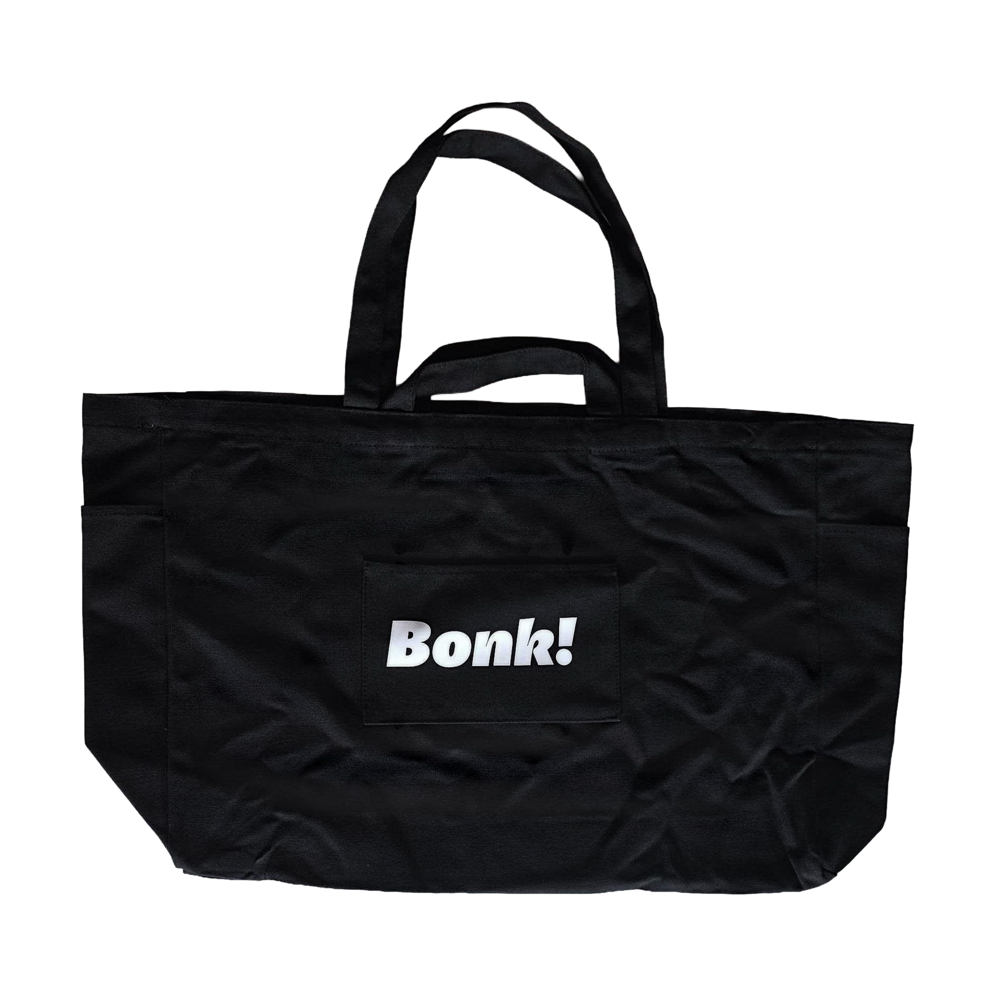 Bonk Canvas Tote in black, back, showing the front pocket and small Bonk! logo
