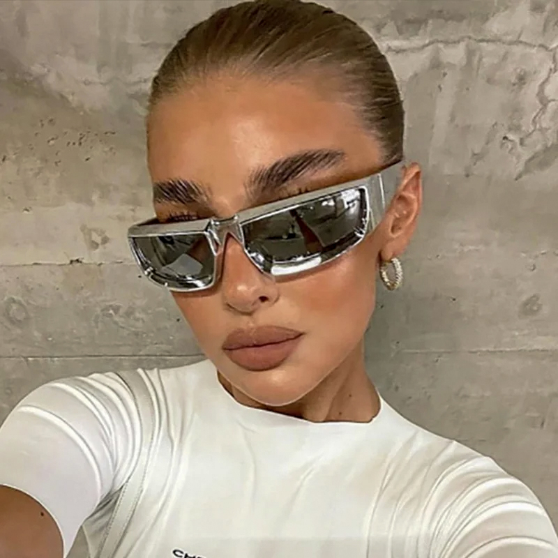 Model wearing T-100 wraparound sunglasses in silver